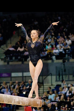 Dynamo gymnast performing on the balance beam